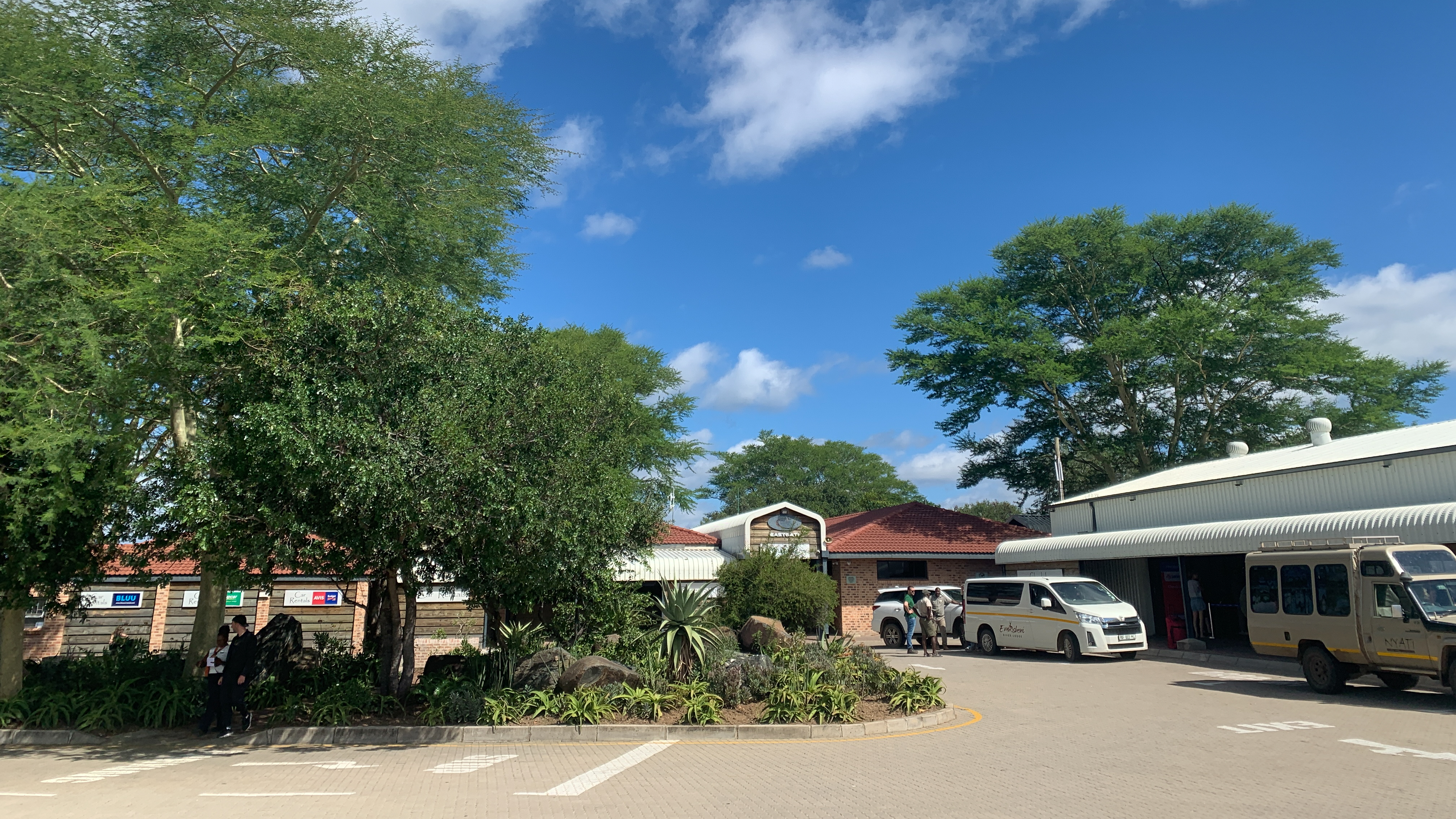 Photo taken from the parking lot that overlooks the main entrance, check in area and baggagecollection at Eastgate Airport.