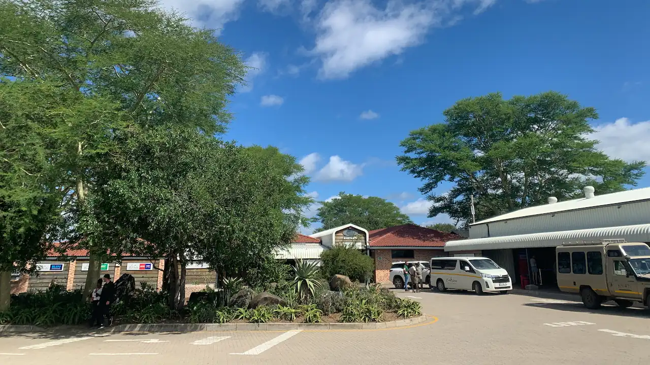 Photo taken from the parking lot that overlooks the main entrance, check in area and baggagecollection at Eastgate Airport.